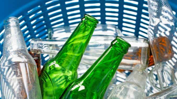 Glass bottles in waste basket.