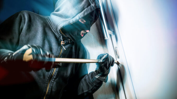 masked burglars breaking and entering into a victim's home